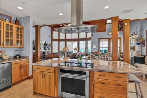 Kitchen island with range/oven, 29 cf refrigerator and freestanding icemaker.