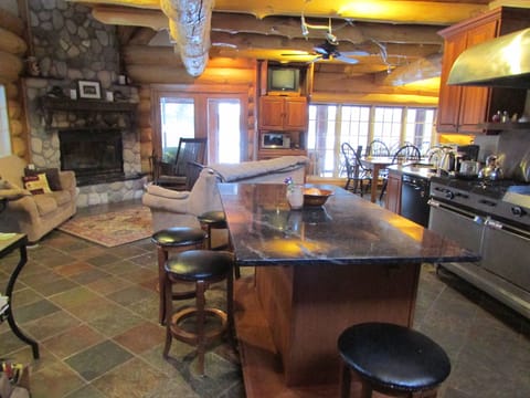 The kitchen and main floor living area, with dining area around the corner