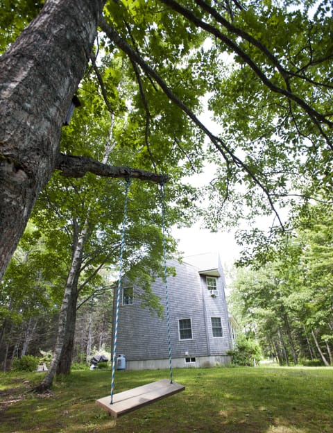 Child-friendly yard area to the sides and rear of the cottage.