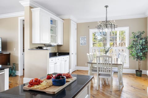 This open-concept kitchen and dining area is perfect for preparing meals while entertaining guests.