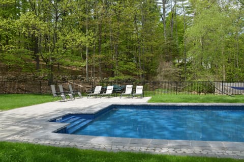 Pool with deck chairs  