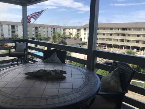 Huge deck overlooking pool and small pond with fountain