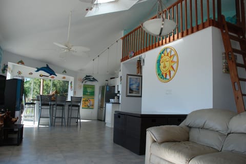 Open living room (now there is no free standing table under loft, instead a bar)