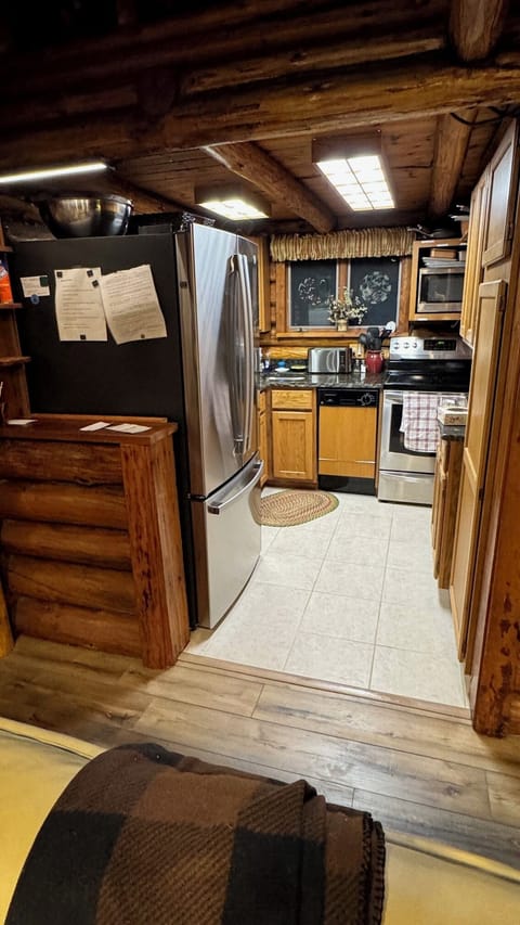 The kitchen has all the amenities including a large refrigerator / freezer.