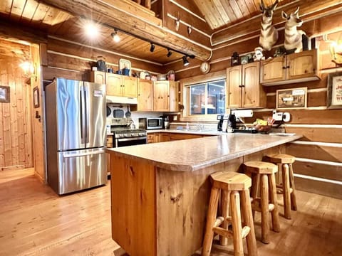 Kitchen with bar and new appliances