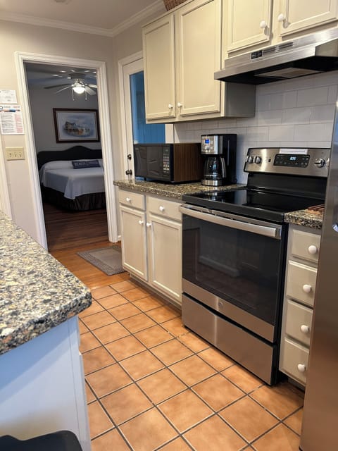 Spacious kitchen w/ solid surface countertops