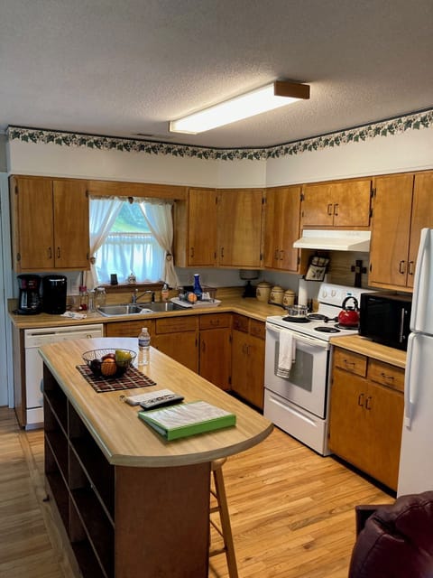 Well equipped kitchen. Pots, pans, plates, toaster, microwave, paper products.