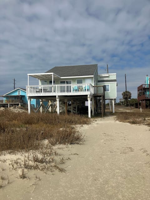 Another picture showing house is on the beach
