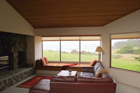 Family Room with view to bluff and ocean.  We supply the wood for the fireplace