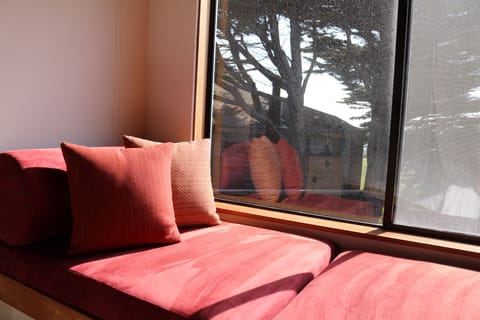 Master Suite - Window Seat with View of Ocean and Wood Burning Fireplace