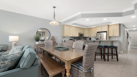 Seating for six around table with three more stool seats at the counter