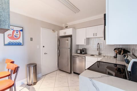 Alternate view of the kitchen. Service Door to the hallway.