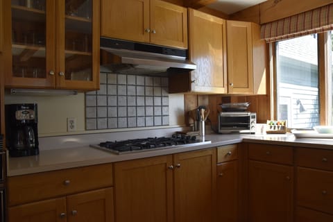 Stove top with separate oven, microwave, toaster oven. Drip coffee and Keurig