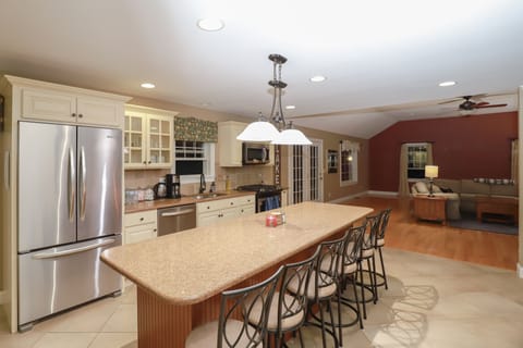 Open layout with w/ island seating for 6 & kitchen flowing into living room