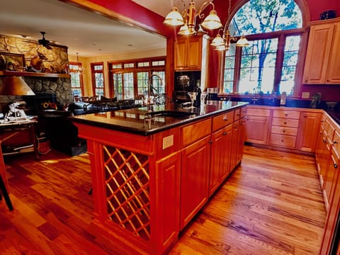 Spacious kitchen stocked with glasses, dishes, pots, pans, appliances & gadgets