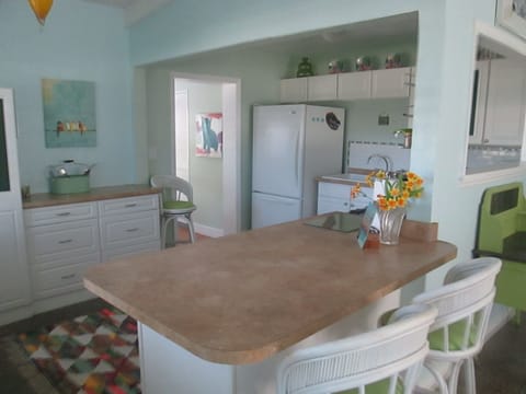 Kitchen with dishwasher ,microwave, toaster ,coffee pot, etc.