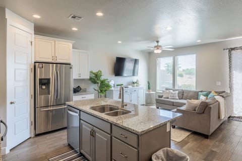 Kitchen View - The kitchen includes a spacious island with plenty of counterspace for meal preparations.