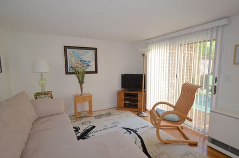 Living room with slider to spacious deck