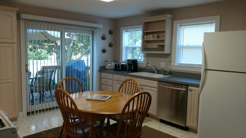Kitchen with sliding door to the deck. 
