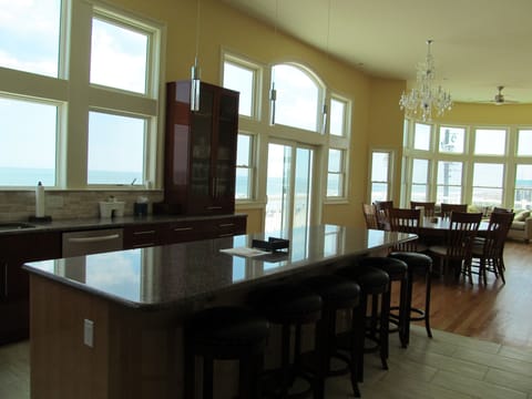 large kitchen island with six stools