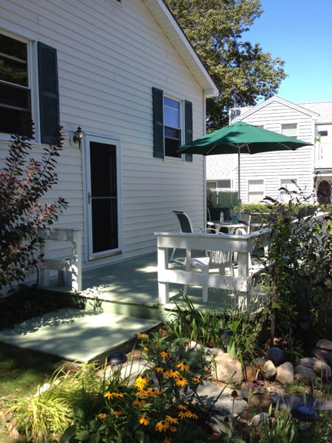 relax after the beach on a comfortable deck with mature gardens