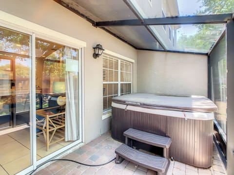 Screened patio with hot tub and lake view
