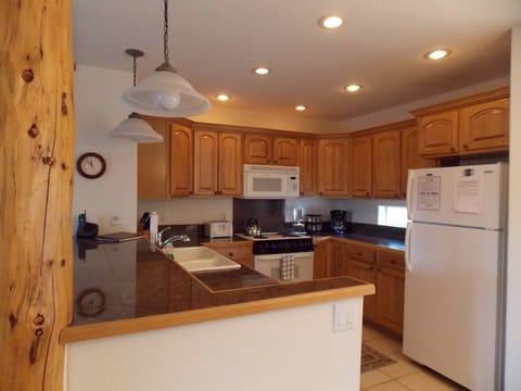 Kitchen with all appliances and cooking utensils