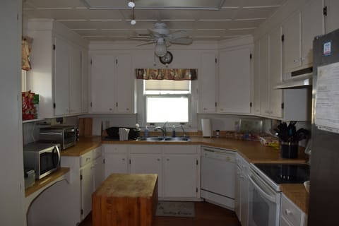 Kitchen with appliances and cooking essentials. 