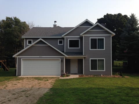 There is a 60' long, two-wide driveway and space next to garage for trailers. 