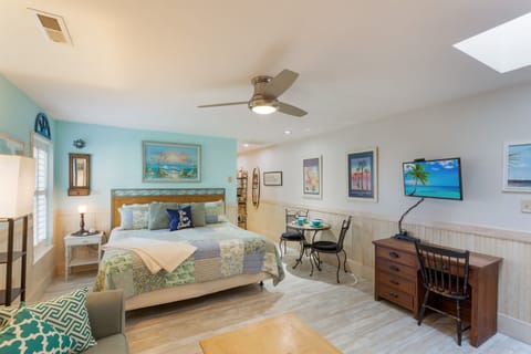 Welcome to this "Key West" themed condo, with large living space - kitchenette is to the right.  TV with Comcast Cable