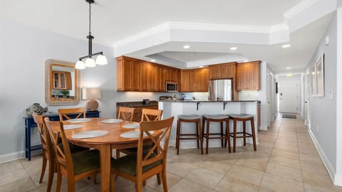 Table seats six with three additional stools for sitting at the bar