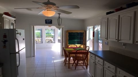 Open kitchen; white cabinets; multiple canal views; eat in dining; W/D/pantry