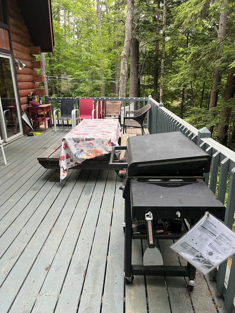 Deck wraps around house.