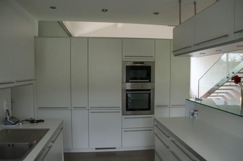 Kitchen showing Hidden Fridge, Wall Oven and Microwave