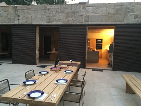 Exterior patio with outdoor kitchen, dining room and sitting area