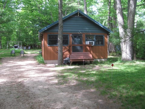 Front of cabin. Relax on the bench and enjoy the lake view across the street.