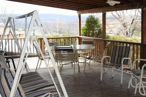 large covered deck with plenty of seating to have a family gathering