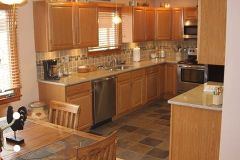 brand new fully equipped kitchen with granite countertops