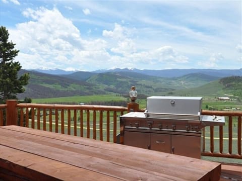 Summer view from deck, picnic table, BBQ.
