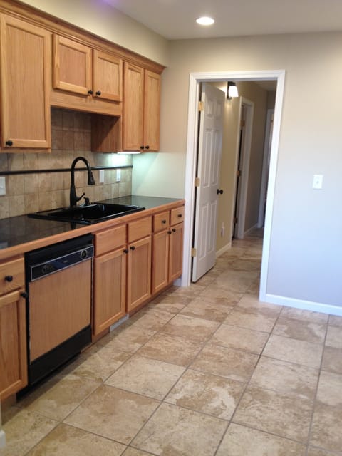 Kitchen-granite counters, stove, refrig. dishwasher. Hallway leads to bedrooms