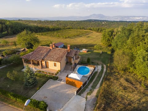 House and surrounding rural area view from above