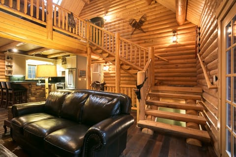Log stairs to game loft and bedrooms