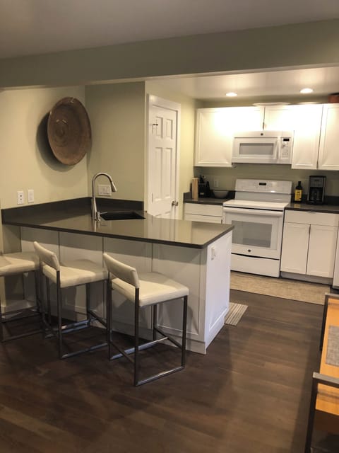 Full kitchen with washer dryer combo and plenty of counter space