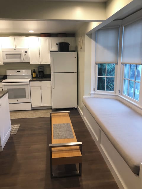 Large cushioned window seat with opening bay window