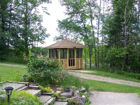 Screen gazebo looking over lake.