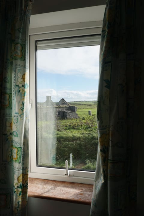 View from the single bedroom: the fields and lovely ruined farmhouse next door.