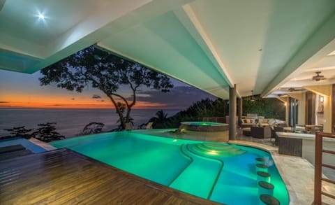 Enjoy a refreshing swim in the pool as the sun sets or under the stars .