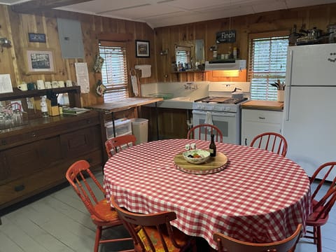 The kitchen is well equipped for cooking and dining.