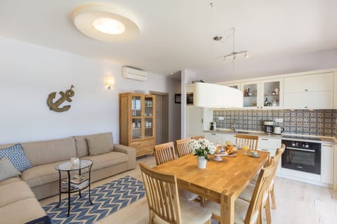 First floor kitchen and dinning area, sitting area and amazing terracce in front