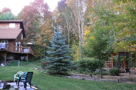 House, Stone Fire Pit and Patio, Gazebo with patio and Koi pond.